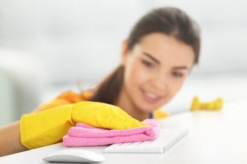 Cleaner checking a workspace for slip and trip hazards