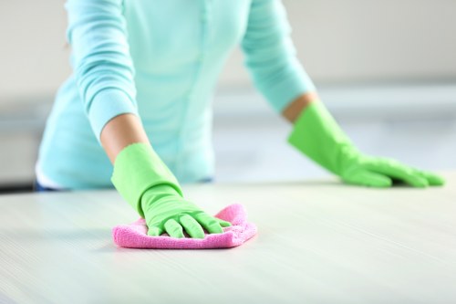 Cleaner in Fulham wearing PPE during a professional clean