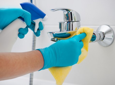 Curtains being carefully cleaned in a Fulham home interior